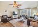 Cozy living room with hardwood floors, comfortable seating, and natural light at 9712 White Barn Way, Riverview, FL 33569