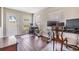Cozy living space featuring neutral tones, a window, and a back door to the yard at 9712 White Barn Way, Riverview, FL 33569