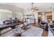 Spacious living room showcasing hardwood flooring and comfortable seating arrangement at 9712 White Barn Way, Riverview, FL 33569