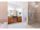 Elegant bathroom with dual sinks, glass-enclosed shower, and a soaking tub at 9908 Alafia River Ln, Gibsonton, FL 33534