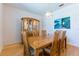 Comfortable dining room with hardwood floors and traditional display cabinet at 9908 Alafia River Ln, Gibsonton, FL 33534