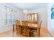 Inviting dining room with hardwood floors and decorative chandelier at 9908 Alafia River Ln, Gibsonton, FL 33534