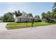 Charming single-story home with manicured lawn, tasteful landscaping, and classic curb appeal at 9908 Alafia River Ln, Gibsonton, FL 33534