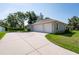 Spacious three-car garage with ample parking space and driveway at 9908 Alafia River Ln, Gibsonton, FL 33534