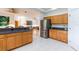 Spacious kitchen with a breakfast bar, modern appliances, lots of storage and access to other rooms at 9908 Alafia River Ln, Gibsonton, FL 33534
