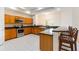 Modern kitchen with stainless steel appliances, granite countertops, and plenty of cabinet space at 9908 Alafia River Ln, Gibsonton, FL 33534