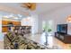 Relaxing living room with easy access to the kitchen and doors that lead to outdoor space at 9908 Alafia River Ln, Gibsonton, FL 33534