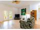 Comfortable living room offering direct access to outdoor spaces, kitchen, and storage room at 9908 Alafia River Ln, Gibsonton, FL 33534