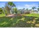 Spacious backyard features a screened-in pool area and lush landscaping at 10011 46Th W Ave, Bradenton, FL 34210