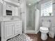 Clean bathroom featuring a vanity with mirror, a walk-in shower, and tiled flooring at 10011 46Th W Ave, Bradenton, FL 34210