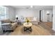 Bright living room with natural light, modern furniture, and an open layout with wood flooring at 10011 46Th W Ave, Bradenton, FL 34210