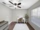 Bright office space with a ceiling fan, window, desk, and chair, offering a great work environment at 10011 46Th W Ave, Bradenton, FL 34210