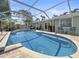 Backyard pool with screen, deck, and seating, ideal for outdoor relaxation and entertaining at 10011 46Th W Ave, Bradenton, FL 34210