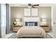 Serene bedroom features a cozy queen bed, soft lighting, and stylish decor at 10193 Trumpet Honeysuckle Way, San Antonio, FL 33576
