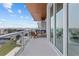 Inviting balcony features a seating area and scenic waterfront views, perfect for relaxation at 1020 Sunset Point Rd # 712, Clearwater, FL 33755