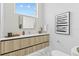 Modern bathroom with sleek vanity, stone countertop, and elegant fixtures at 1020 Sunset Point Rd # 712, Clearwater, FL 33755