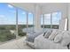 Bright bedroom with floor-to-ceiling windows and scenic water views at 1020 Sunset Point Rd # 712, Clearwater, FL 33755