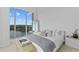 Cozy bedroom with bright natural light, light wood floors, and modern decor at 1020 Sunset Point Rd # 712, Clearwater, FL 33755
