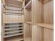 Spacious walk-in closet with custom wood shelving and drawers at 1020 Sunset Point Rd # 712, Clearwater, FL 33755