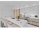 Contemporary kitchen featuring an island with seating, stainless steel appliances, and modern finishes at 1020 Sunset Point Rd # 712, Clearwater, FL 33755
