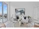 Bright living room area with comfortable seating and large windows with balcony at 1020 Sunset Point Rd # 712, Clearwater, FL 33755