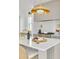 Elegant kitchen featuring a large island, a gas range, and a marble backsplash at 1201 35Th N Ave, St Petersburg, FL 33704