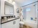 Nicely appointed bathroom features a tub with shower, vanity, and modern fixtures at 12010 Jackson Landing Pl, Tampa, FL 33624