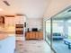 Modern kitchen with stainless appliances, and sliding doors to an outdoor seating area at 12010 Jackson Landing Pl, Tampa, FL 33624