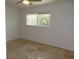 Bedroom featuring a ceiling fan and window at 12055 4Th E St, Treasure Island, FL 33706