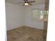 Bedroom featuring a ceiling fan and window with blinds at 12055 4Th E St, Treasure Island, FL 33706