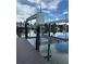 Modern boat lift on the canal with clear skies and beautiful waterfront views at 12055 4Th E St, Treasure Island, FL 33706