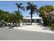 Charming single story home with tropical landscaping and white rock accents at 12055 4Th E St, Treasure Island, FL 33706