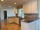 Bright kitchen with granite countertops, tile backsplash, stainless appliances, and an open layout at 12055 4Th E St, Treasure Island, FL 33706