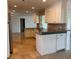 Bright kitchen with granite countertops, tile backsplash, stainless appliances, and an open layout at 12055 4Th E St, Treasure Island, FL 33706