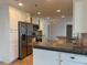 Bright kitchen with granite countertops, tile backsplash, stainless appliances, and an open layout at 12055 4Th E St, Treasure Island, FL 33706