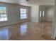 Inviting living room featuring a light-filled interior with neutral walls and stylish tile flooring at 12055 4Th E St, Treasure Island, FL 33706
