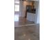 Spacious open-concept living room with stone tile and bright natural light at 12055 4Th E St, Treasure Island, FL 33706