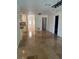 Open-concept living space showcasing a bright, naturally-lit interior with a tile floor at 12055 4Th E St, Treasure Island, FL 33706