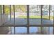 View from inside the home of the outdoor bar, backyard, and pool at 12055 4Th E St, Treasure Island, FL 33706
