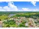 An aerial view of a residential neighborhood near a lake at 1212 Baycove Ln, Lutz, FL 33549