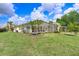 Large lush backyard features a screened pool and spa at 1212 Baycove Ln, Lutz, FL 33549