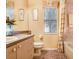 Bathroom with tiled floors and shower/tub, large mirror, and granite-look counter at 1212 Baycove Ln, Lutz, FL 33549