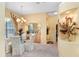 Bright dining area features carpet, chandelier, and view to backyard at 1212 Baycove Ln, Lutz, FL 33549