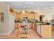 Well-equipped kitchen with an island, breakfast bar, and bright wooden cabinetry at 1212 Baycove Ln, Lutz, FL 33549