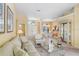 Open living area leads to the dining room, featuring neutral walls, plush carpet, and lots of natural light at 1212 Baycove Ln, Lutz, FL 33549