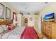 Comfortable main bedroom offers an ensuite bathroom, neutral carpet and ceiling fan at 1212 Baycove Ln, Lutz, FL 33549