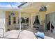 Spacious covered patio area with ceiling fans, furnishings, and pool views at 1212 Baycove Ln, Lutz, FL 33549
