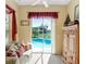 Cozy sitting room showcases pool views through sliding glass doors, offering a tranquil retreat at 1212 Baycove Ln, Lutz, FL 33549