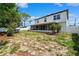 View of the home with a large backyard and partial fence at 12470 Elgin Blvd, Spring Hill, FL 34609
