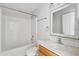 Simple bathroom with white tiled walls and a clean, well-lit vanity area at 12470 Elgin Blvd, Spring Hill, FL 34609